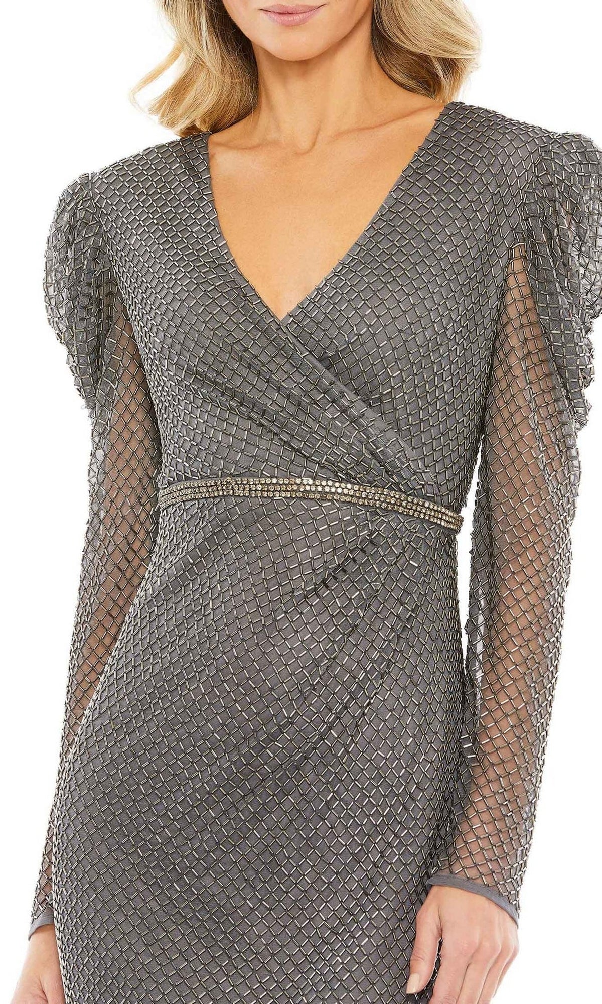 Woman wearing the Short Wedding Guest Dress 93674 by Mac Duggal—a textured silver faux wrap dress with long sleeves, a deep V-neckline, fitted waist, and mesh overlay—perfect for a chic semi-formal look.
